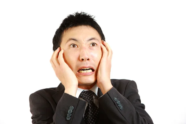 Frightened Japanese businessman — Stock Photo, Image