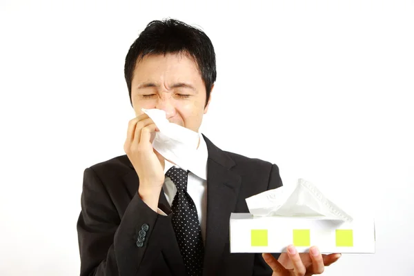 Empresário japonês sofre de corrimento nasal — Fotografia de Stock