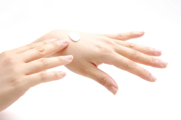 Aplicar crema de manos a las manos —  Fotos de Stock