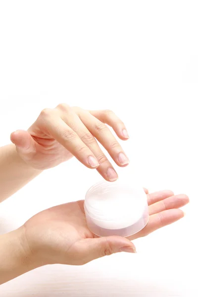 Applying hand cream to hands — Stock Photo, Image