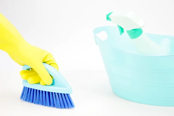 Hand with glove using cleaning brush to clean up the floor — Stock Photo, Image