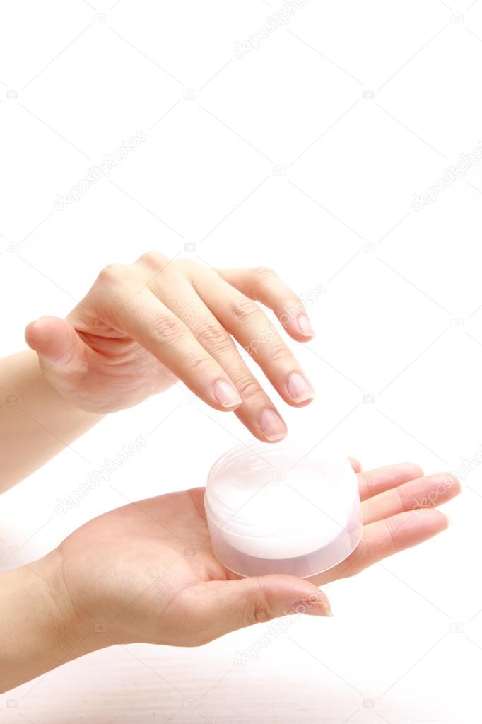 Applying hand cream to hands