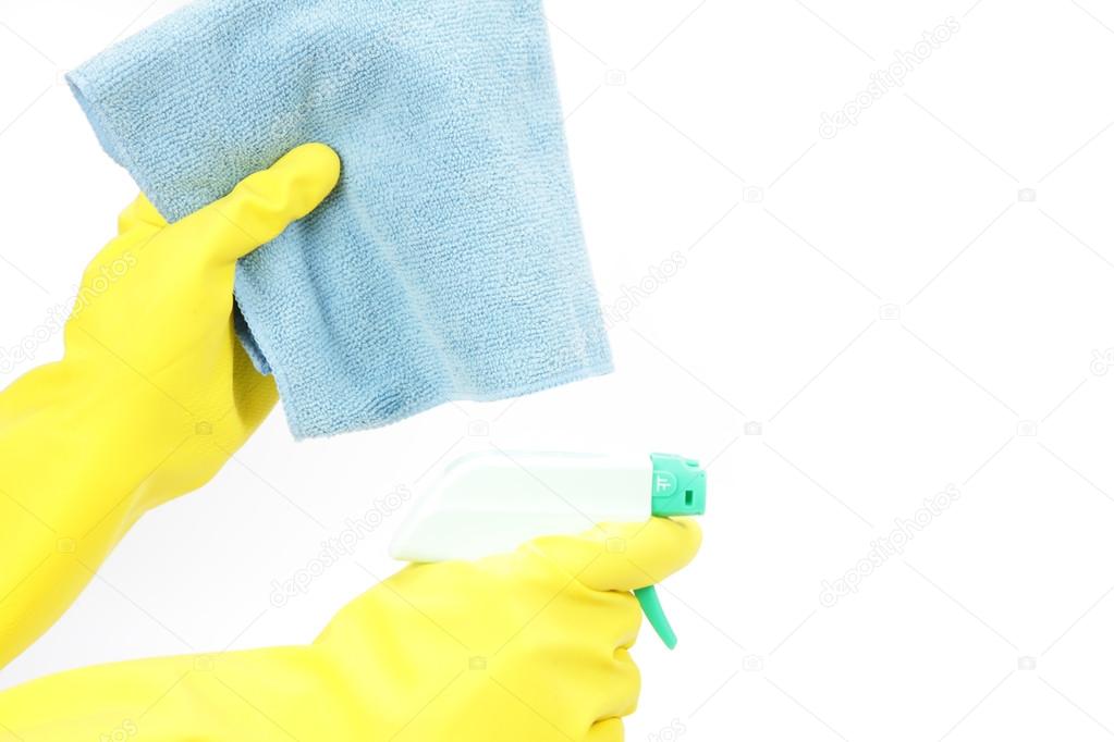 Hands in rubber gloves with spray and a cloth　