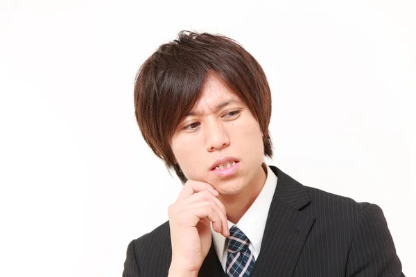 Fiatal japán üzletember aggódik valami — Stock Fotó