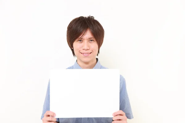 Young Japanese man with message board — Stock Photo, Image