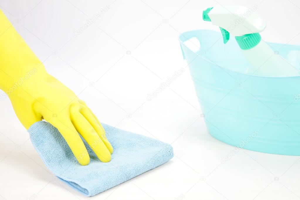 Hand with rubber glove wiping with a cloth　