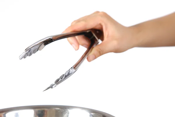 Hand with Tongs — Stock Photo, Image