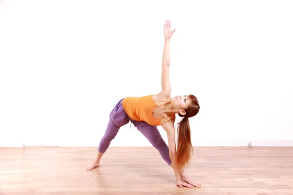 Young Japanese Woman Doing YOGA extended triangle pose — Stock Photo, Image