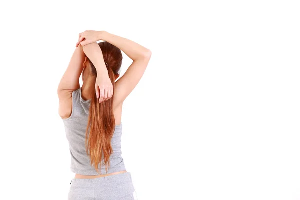 Jovem mulher fazendo alongamento — Fotografia de Stock