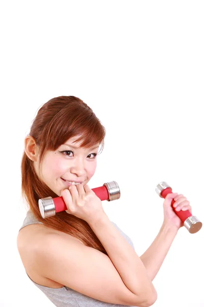 Young Japanese woman doing dumbbell exercises — Stock Photo, Image