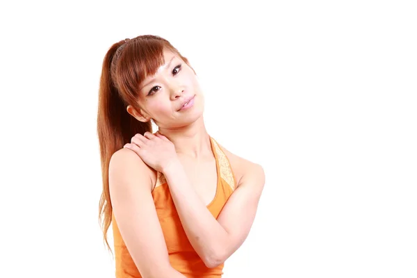 Young Japanese woman suffer from a stiff neck — Stock Photo, Image