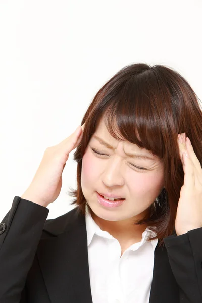 Businesswoman suffers from headache — Stock Photo, Image