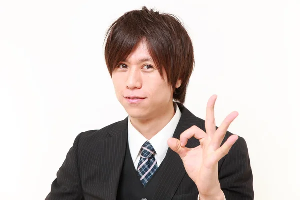 Joven japonés hombre de negocios mostrando signo perfecto —  Fotos de Stock