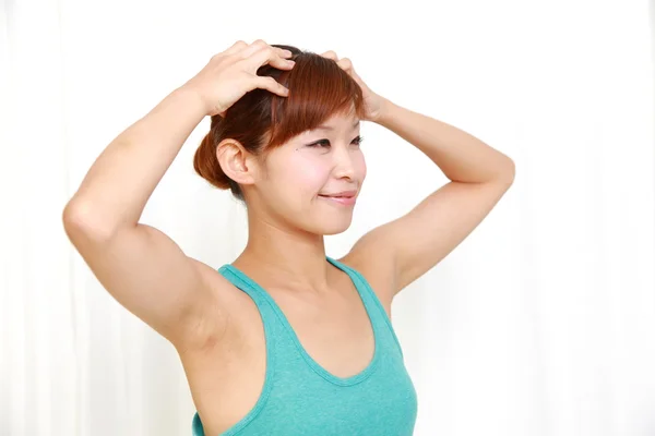 Young woman doing self head massage — Stock Photo, Image