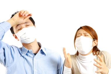 Japanese Couple suffers from allergic rhinitis clipart