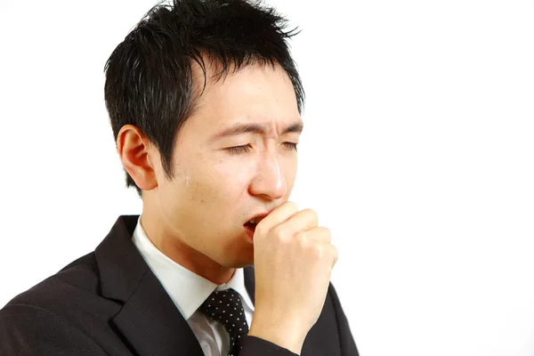 ひどい咳に苦しむ日本のビジネスマン — ストック写真