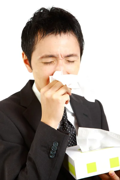 Japanese businessman suffer from a runny nose — Stock Photo, Image