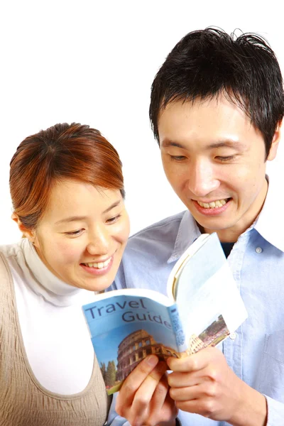 Young happy couple planning a travel — Stock Photo, Image