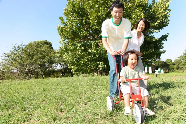 Japanese family playing in the park — Stock Photo, Image