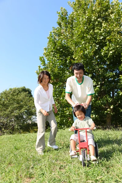 Japanese family playing in the park — Stock Photo, Image