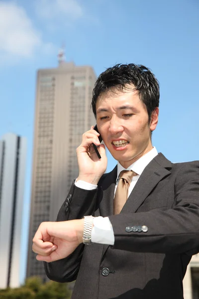 Too busy businessman — Stock Photo, Image