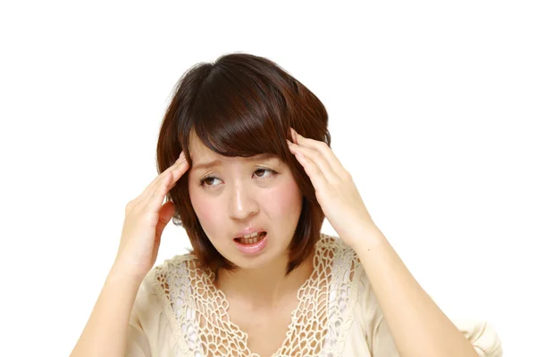 Woman suffers from headache — Stock Photo, Image