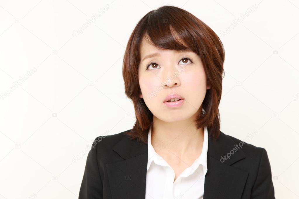 Businesswoman worries about something