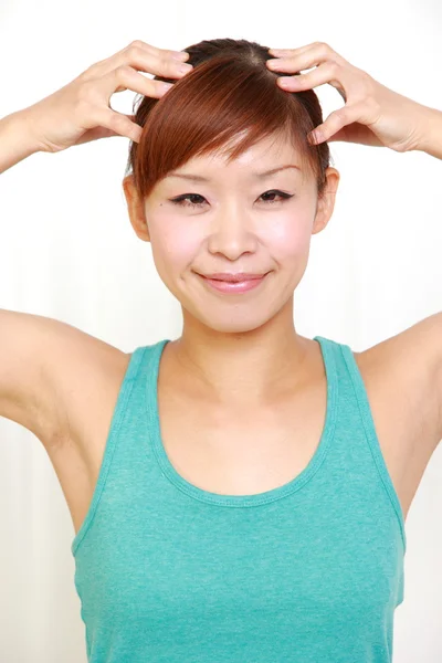 Young woman doing self head massage — Stock Photo, Image