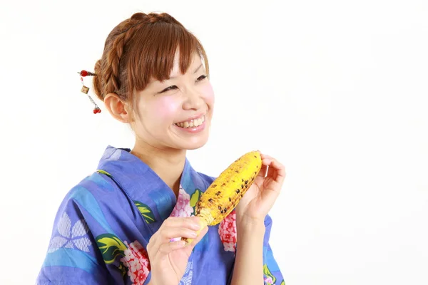 Japanese woman with grilled corn — Stock Photo, Image