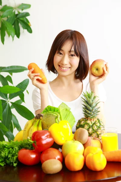 Young Japanese woman with fruits and vegetables — Stock Photo, Image