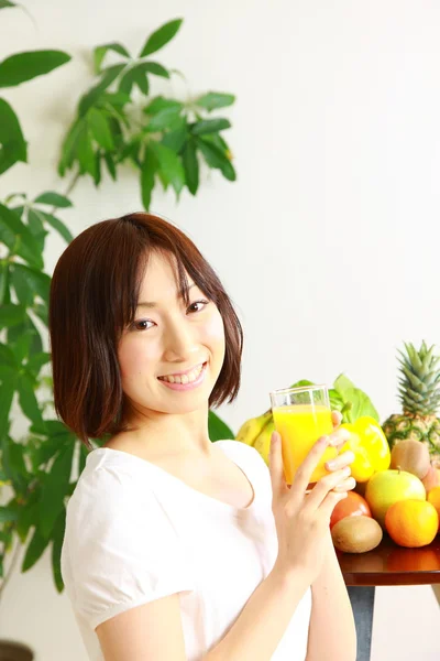 Young Woman drinks juice — Stock Photo, Image