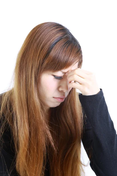 Young Japanese woman suffers from Asthenopia — Stock Photo, Image