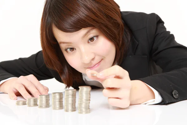 Businesswoman Put Coins To Stack Of Coins — Stock Photo, Image