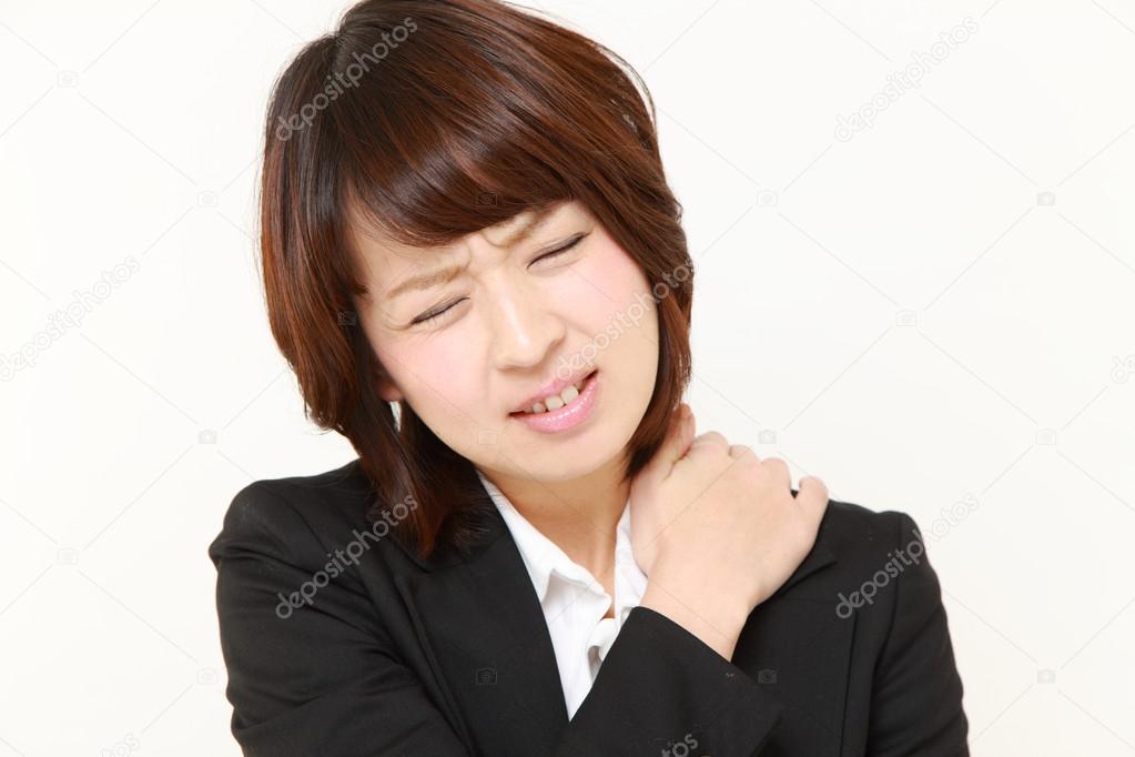 Japanese businesswoman suffers from neck ache