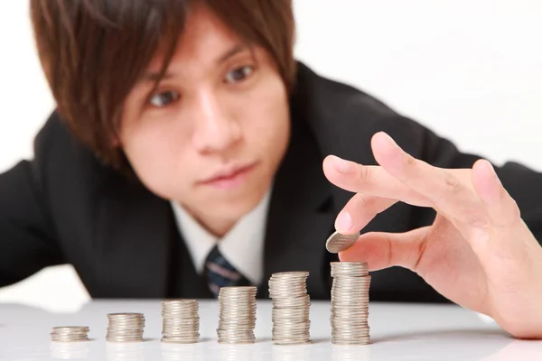 Businessman Put Coins To Stack Of Coins — Stock Photo, Image
