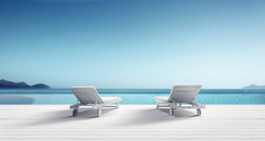 Denize yakın kumsalda ahşap şezlonglar. Tatil arkaplanı.