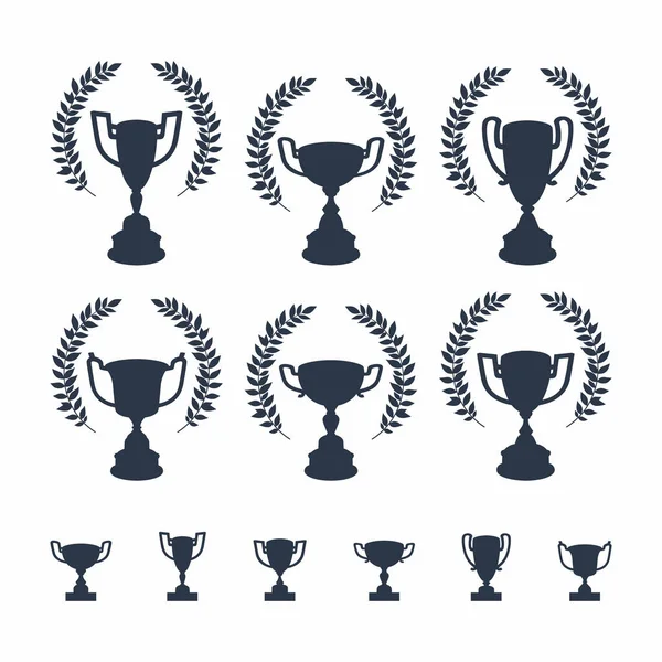 Trophy cups set. Black silhouettes of award cups in different shapes — Stock Vector