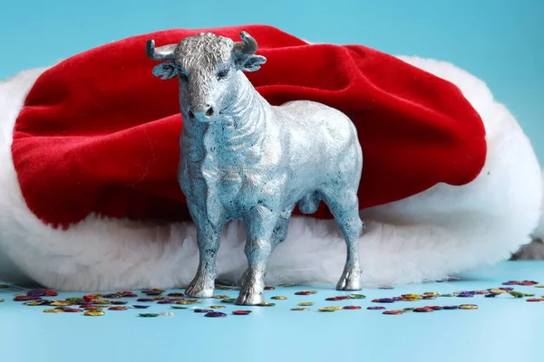 White Metal Bull is the Symbol of 2021 on blue background