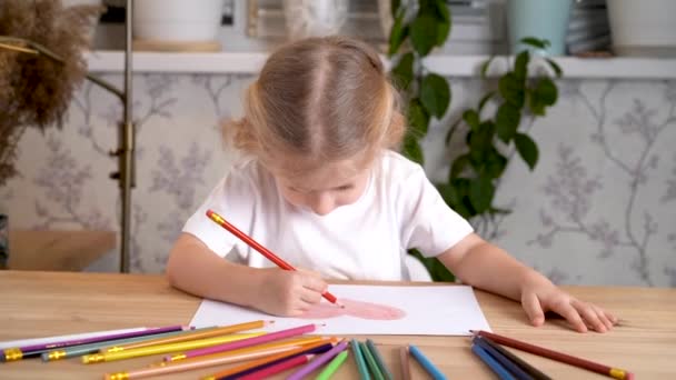 Little Girl Enthusiastically Draws Heart Colored Pencils Sitting Table Home — Stock Video