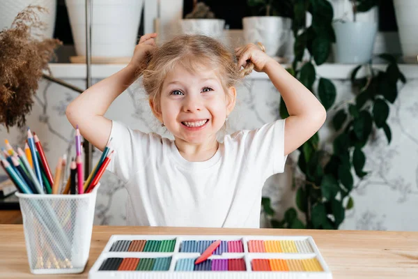Small Blonde Girl Charming Smile Sits Table Bright Colorful Palette — Stock Photo, Image