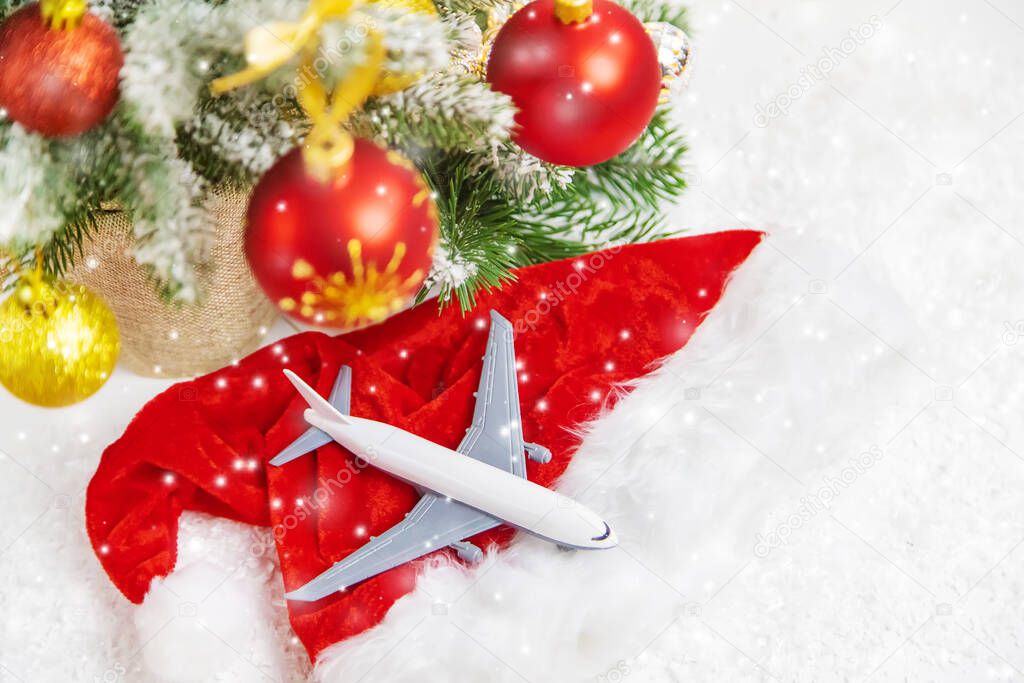 Travel for Christmas. Airplane with Christmas decor. Selective focus.