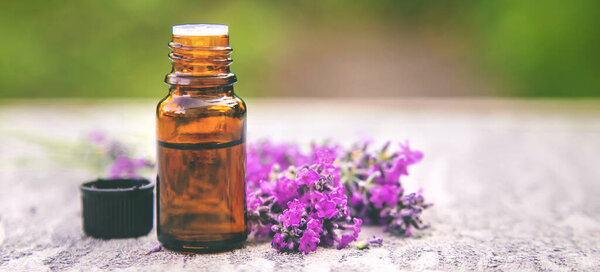Lavender essential oil in a small bottle. Selective focus. nature.