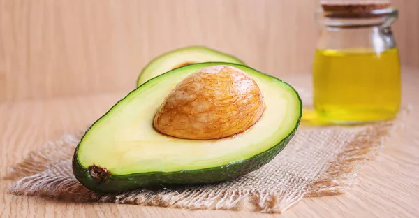 Avokádo Avokádo Olej Dřevěném Pozadí Selektivní Fokus Food — Stock fotografie