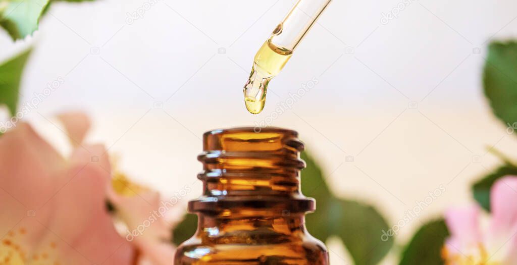 rosehip extract in bottles. Homeopathy. Selective focusnature