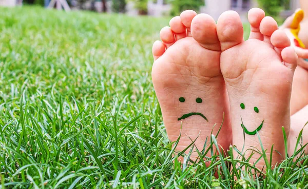 Baby Feet Paint Pattern Smiling Sad Green Grass Selective Focus — 스톡 사진