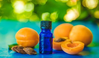 Apricot kernel oil in a bottle. Selective focus.