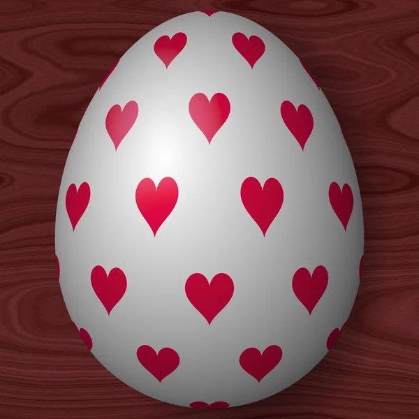 White decorated Easter egg with hearts on wooden texture — Stock Photo, Image