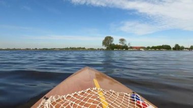 Canoeing on a lake around Sneek in The Netherlands
