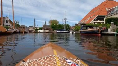 Canoeing towards downtown Heeg in The Netherlands