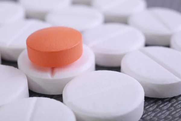 Red and white pill capsules pile — Stock Photo, Image